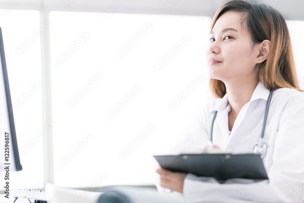 Portrait of a smiling physician working in her office. Asia Portrait of a smiling physician working in her office. Asia