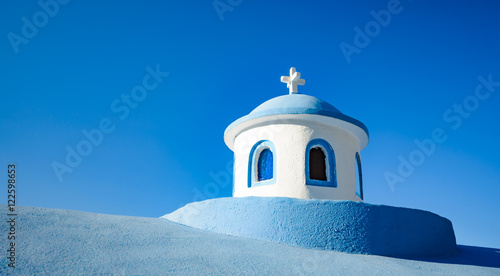 Typical blue tower of the small Greek church, the Greek island o