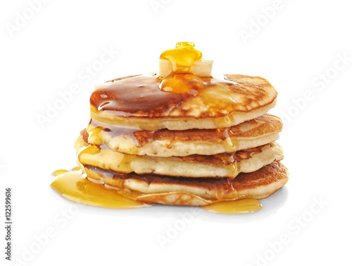 Tasty pancakes with honey and butter, isolated on white
