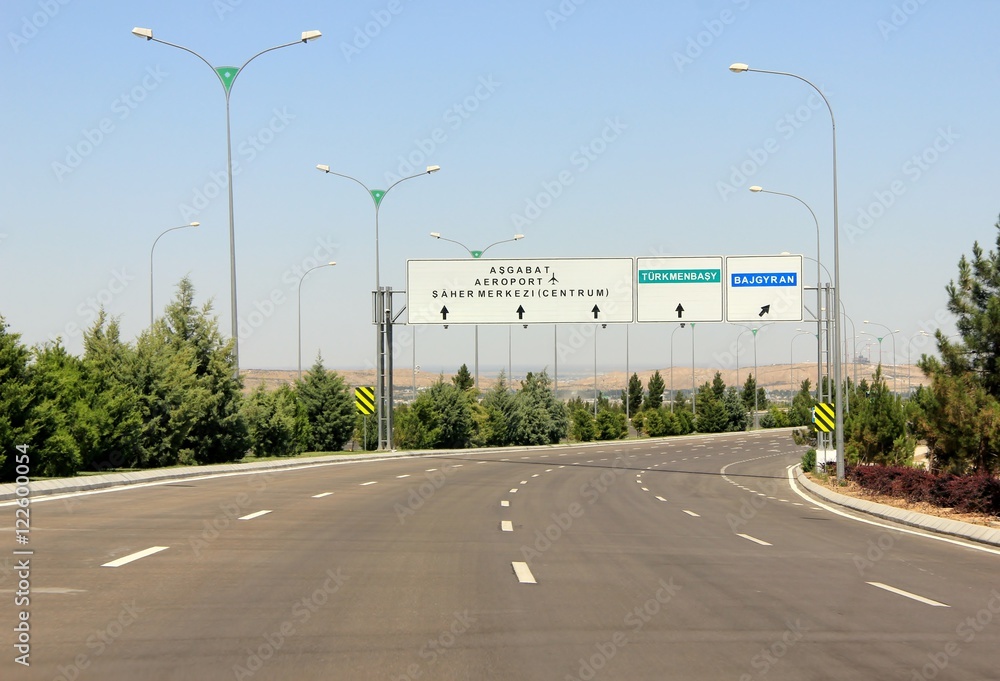 Road signs against clear blue sky. Ashgabat, Turkmenistan