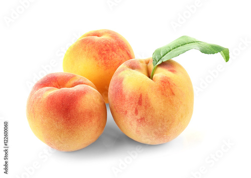 Juicy ripe peaches isolated on white