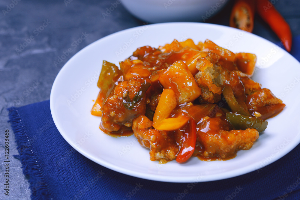 sweet and sour pork with rice. deep fried crispy pork stir fried with pineapple and fresh capsicum in sour and sweet sauce. worldwide famous chinese cuisine. sweet and sour pork with rice. deep fried crispy pork stir fried with pineapple and fresh capsicum in sour and sweet sauce. worldwide famous chinese cuisine.