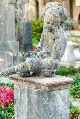 Stone Angel statue in ancient cemetery