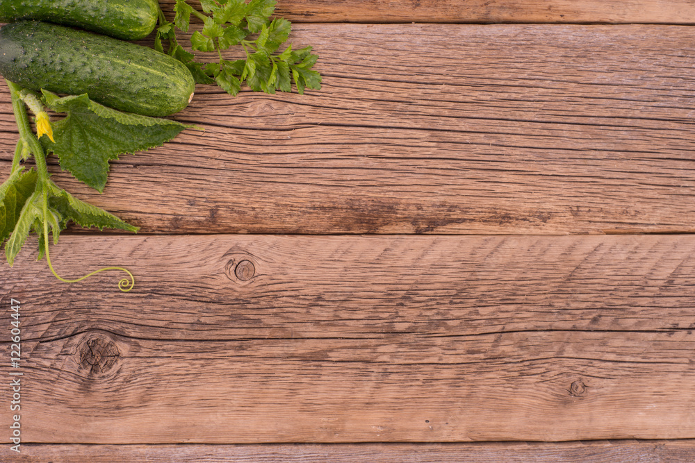 Fresh cucumbers on the old wooden table. Fresh cucumbers on the old wooden table.