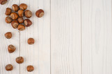 Hazelnuts on a old wooden table.