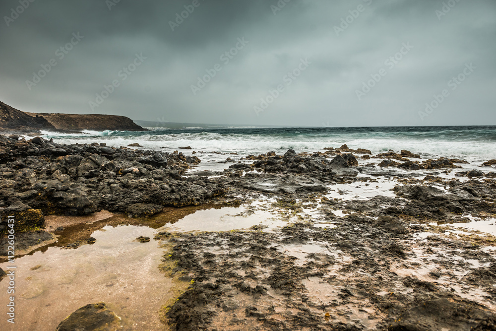 stones and seawaves on Lanzarote seashore