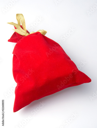 red bag for gift with gold ribbon