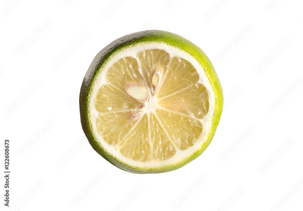 Green lemon cut half slice isolated on white background Green lemon cut half slice isolated on white background