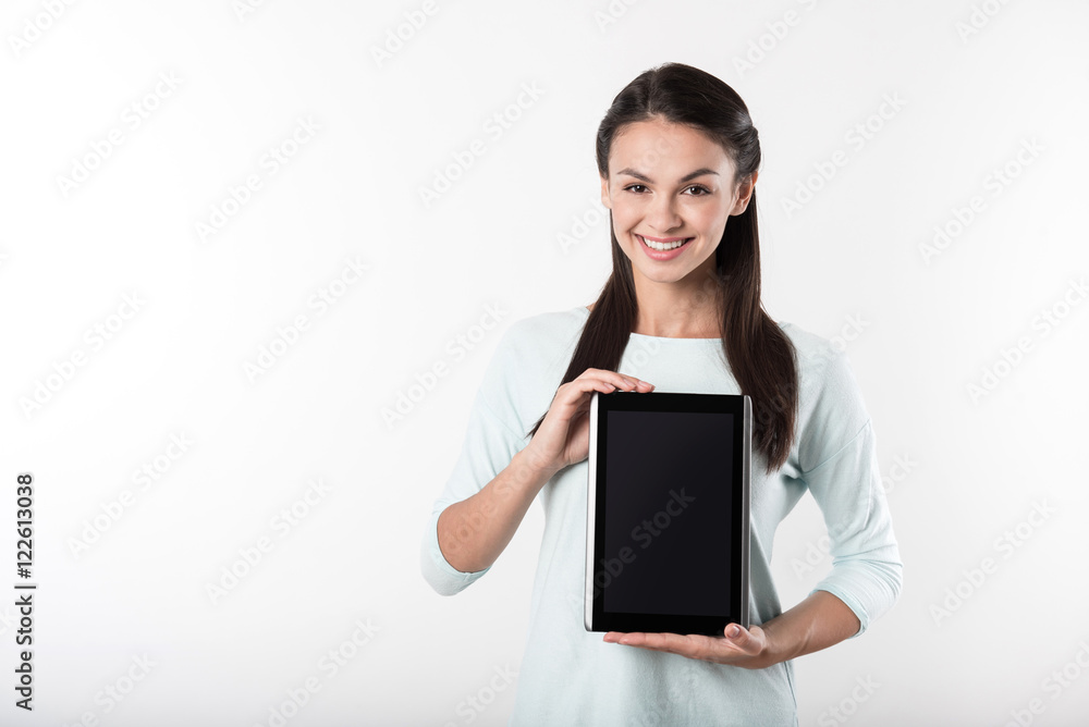 Positive woman holding tablet Positive woman holding tablet