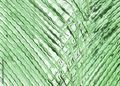 Green background made of pattern with palm tree leaves