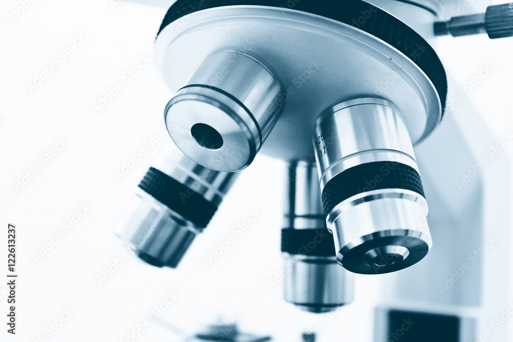 Objective Lens of Microscope Isolated on the White Background Objective Lens of Microscope Isolated on the White Background