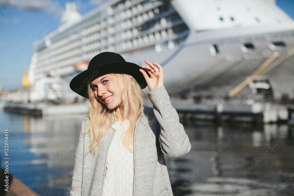 beautiful woman in a hat at sea cruise liner