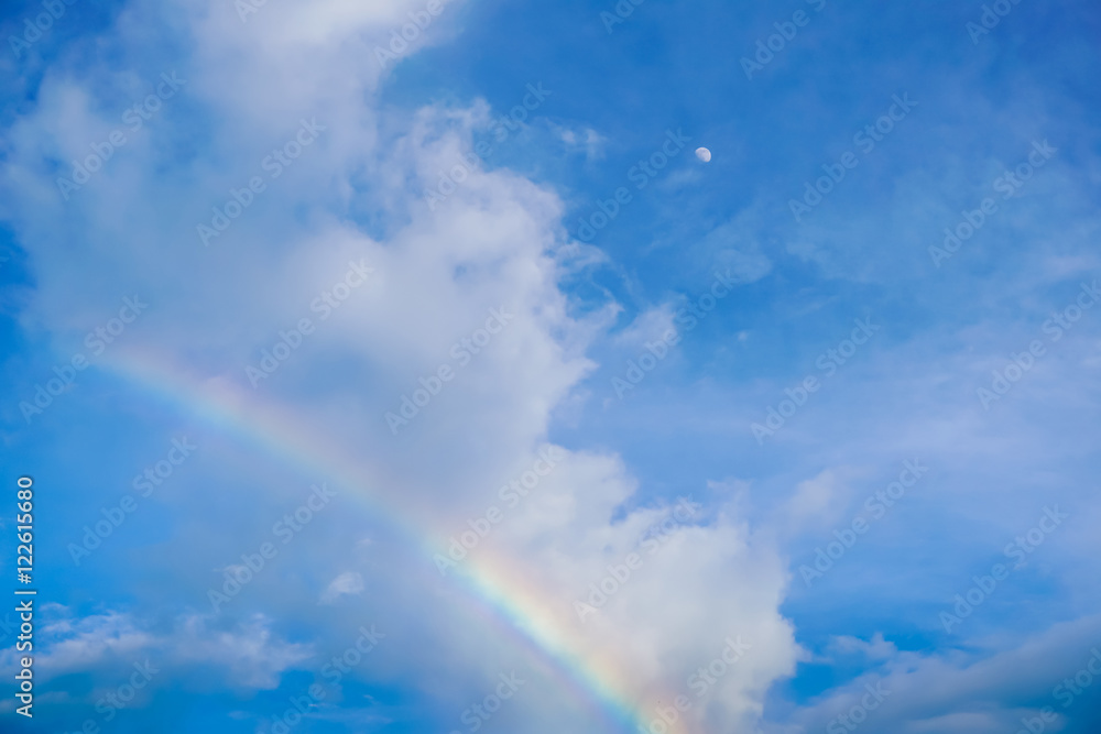 rainbow on blue sky background and the moon rainbow on blue sky background and the moon