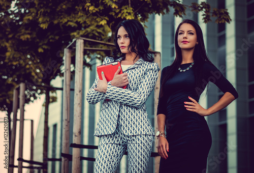 Portrait of two women in a city.