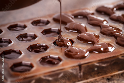 Putting chocolate in mold