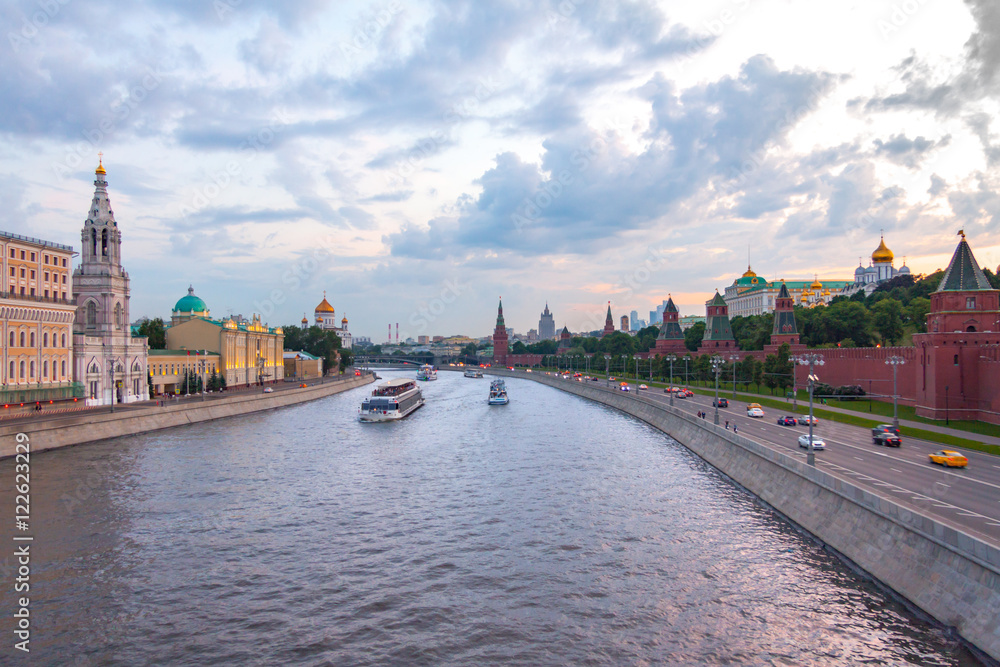 View at Moscow Kremlin, Kremlevskaya and Sofiyskaya embankments from the Moskvoretsky bridge at sunset in summer, the most famous landmark in Russia