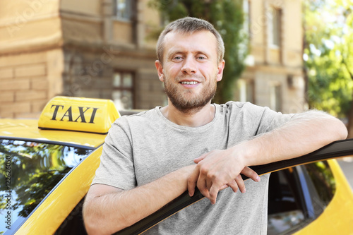 Handsome taxi driver near c...