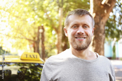 Handsome taxi driver near c...