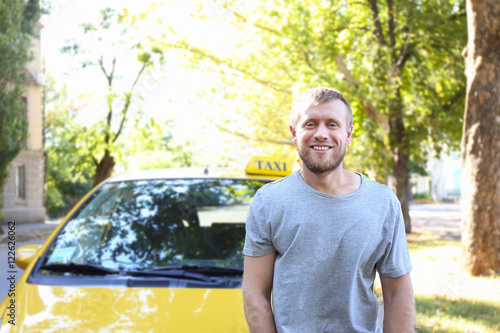 Handsome taxi driver near c...