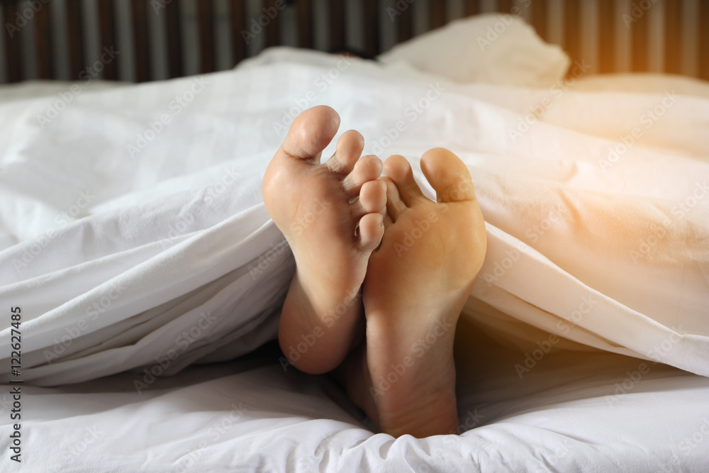 woman feet in bed woman feet in bed