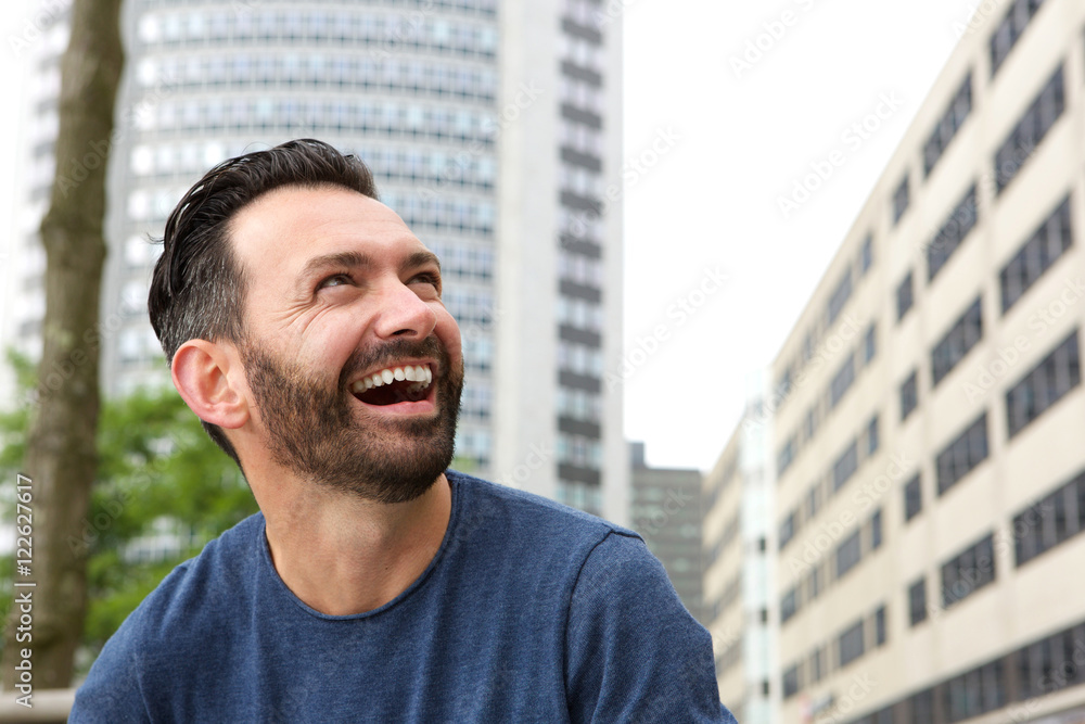 Mature guy with beard laughing Mature guy with beard laughing