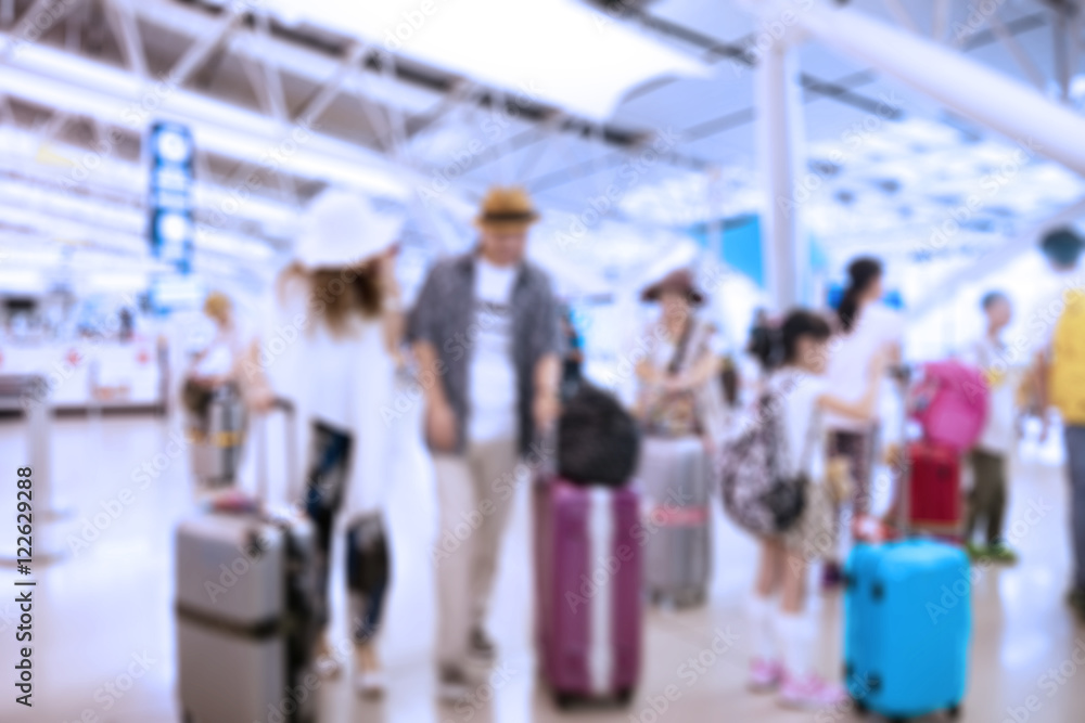 People traveling at airport terminal in blurred motion with retro color effected