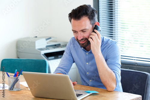 Mature business man working at his desk