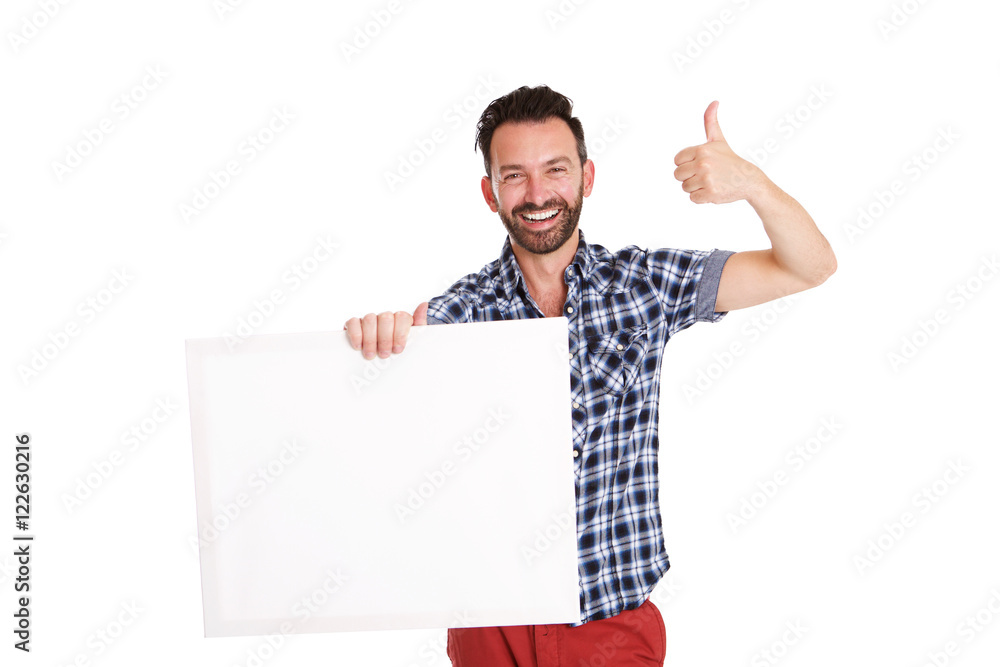 Confident mature man holding blank poster and showing thumbs up