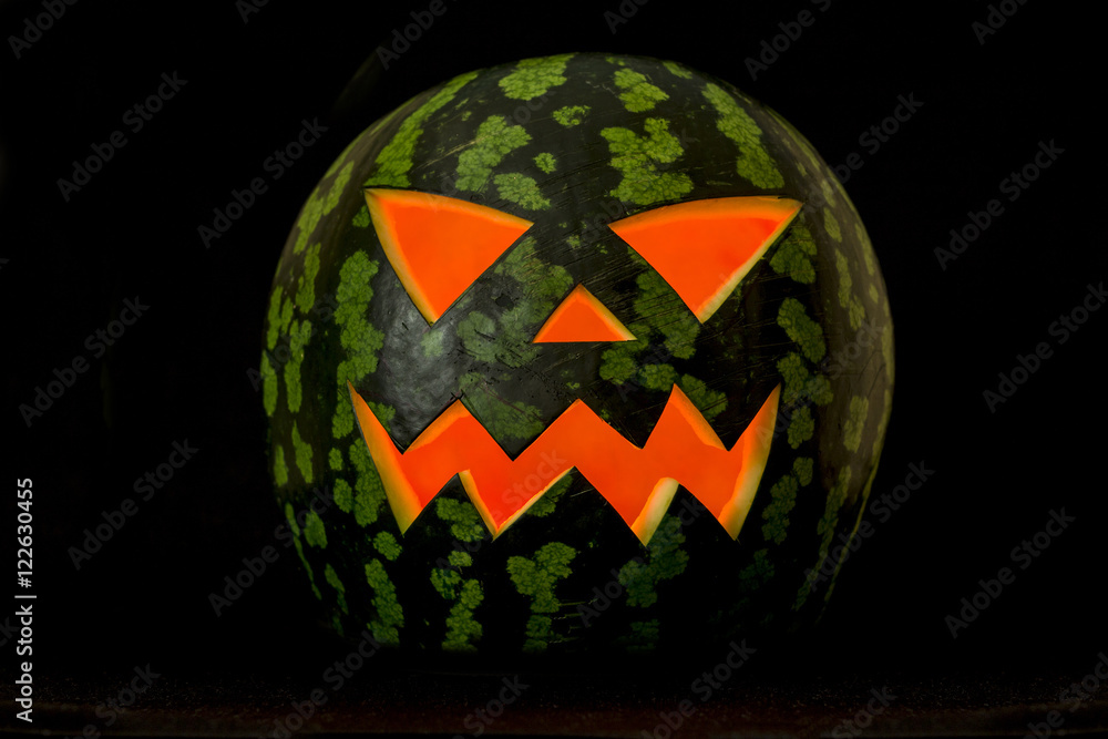 Obraz premium Jack'O Lantern, halloween watermelon in the dark