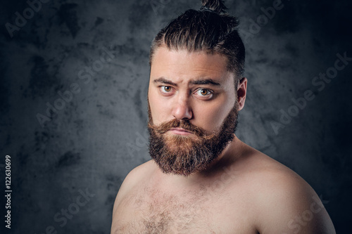 Bearded male on grey background. © Fxquadro