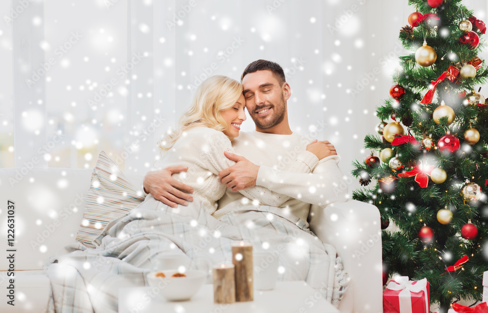 happy couple at home with christmas tree happy couple at home with christmas tree