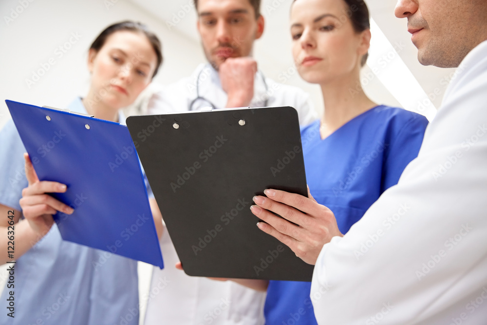 close up of doctors with clipboard at hospital close up of doctors with clipboard at hospital