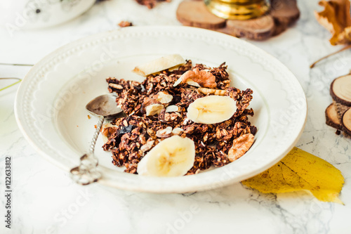 Homemade сhocolate granola with banana and peanut butter
