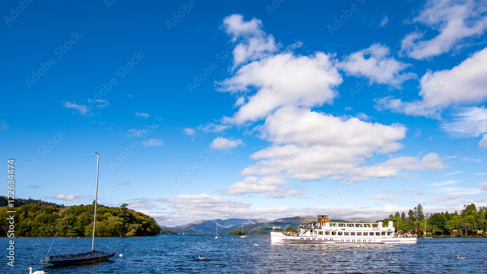 Lake Windermere ferry, cruise boat: Teal including boats and blue sky with white clouds