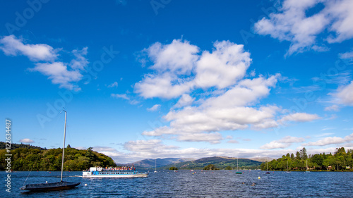 Lake Windermere ferry, cruise boat: Miss Cumbria including boats and blue sky with white clouds