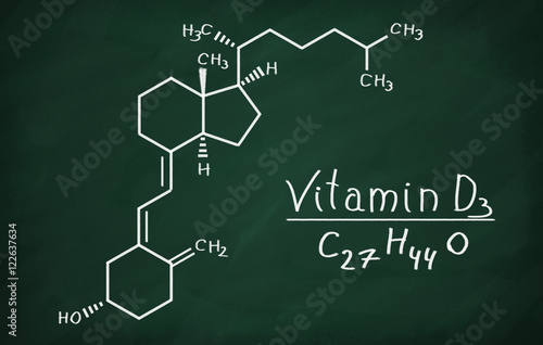 Structural model of Vitamin D3 molecule on the blackboard.