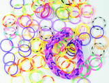 Multicolored rubber bands used in making loom bracelet on a white background.
