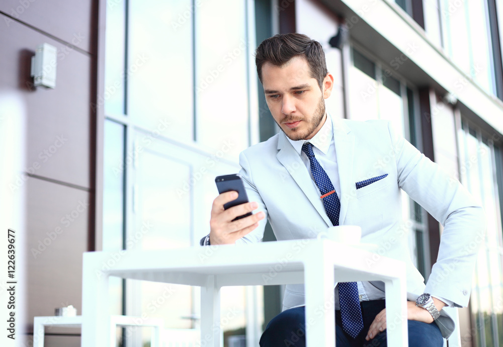 Man on smartphone - young business man talking on smart phone. Casual urban professional businessman using mobile cell phone Man on smartphone - young business man talking on smart phone. Casual urban professional businessman using mobile cell phone