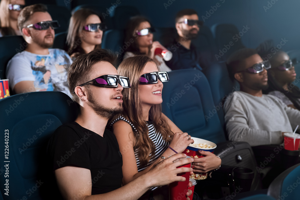 Young happy couple having a date at the cinema Young happy couple having a date at the cinema
