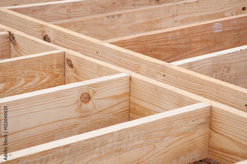 Obraz premium Floor joists made of lumber on construction site