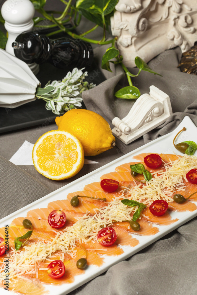 carpaccio of salmon with cherry tomatoes and wine and Aperol