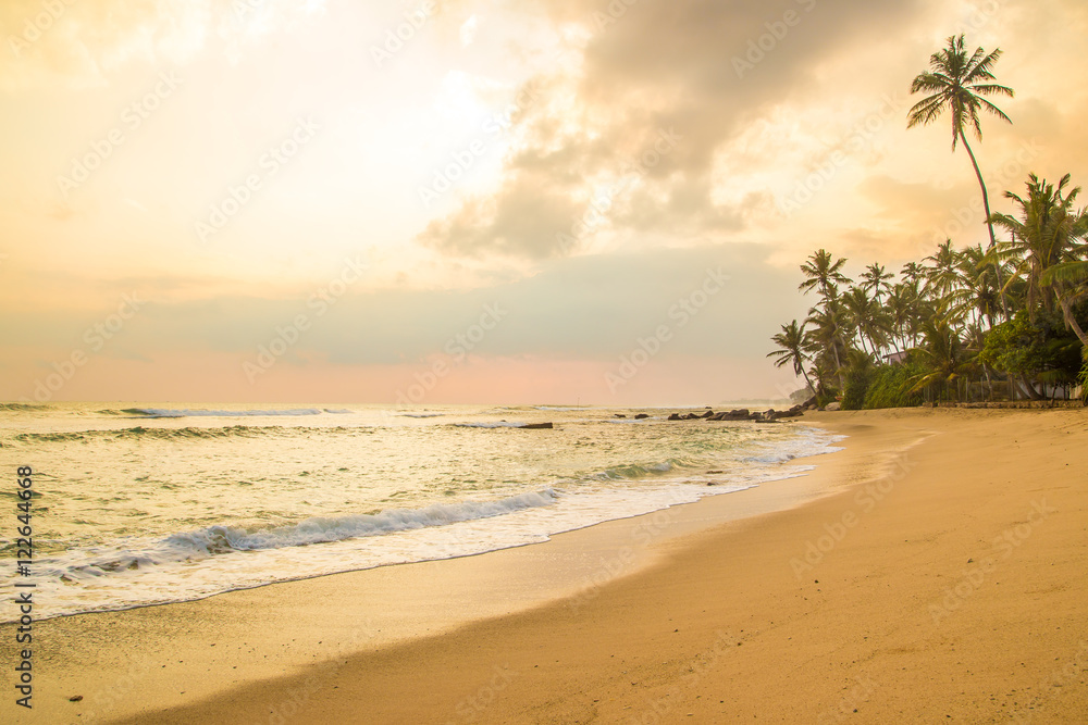 Beautiful sunset at tropical beach in Sri Lanka