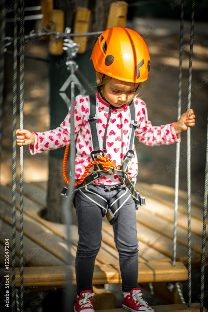 sports happy kid climbs through the ropes sports happy kid climbs through the ropes