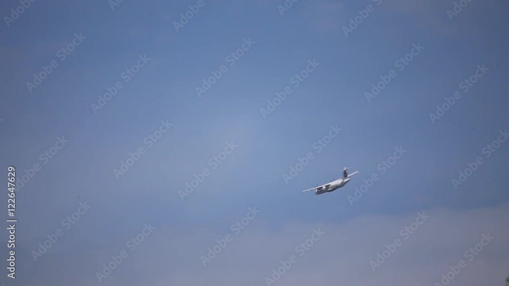 The plane flies on blue sky background
The plane flies on blue sky background
