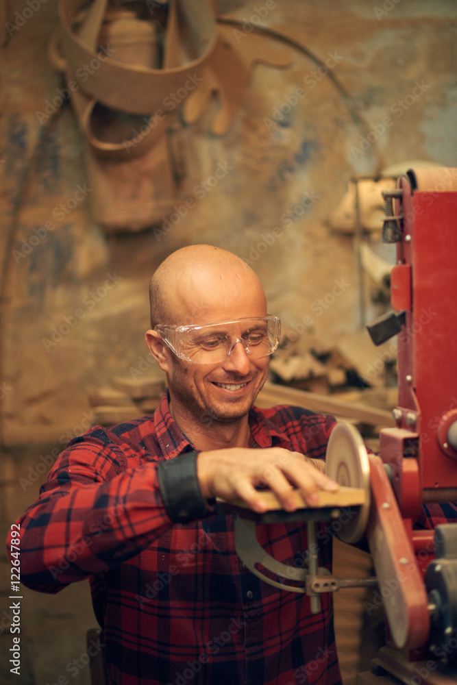 Carpenter using circular sander Carpenter using circular sander