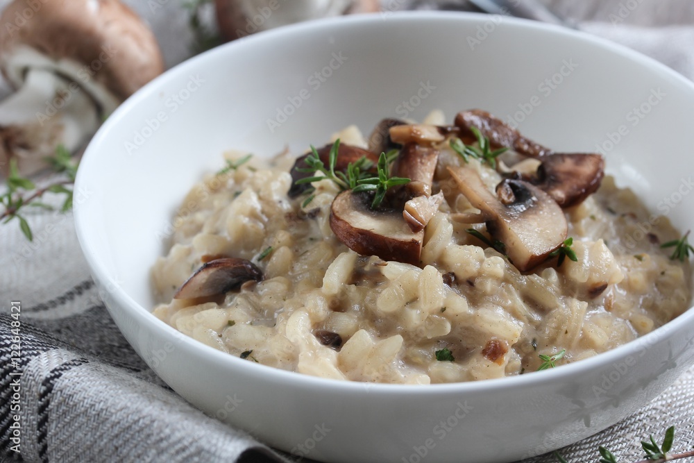 Mushroom Risotto served in a bowl, selective focus Mushroom Risotto served in a bowl, selective focus