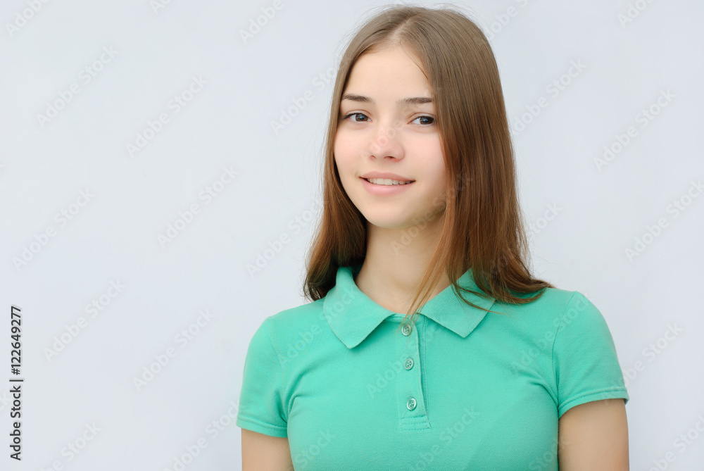 Portrait of beautiful young woman with clean skin on grey background Portrait of beautiful young woman with clean skin on grey background