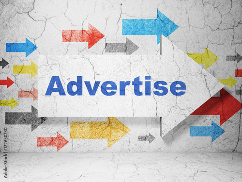 Marketing concept  arrow with Advertise on grunge wall background