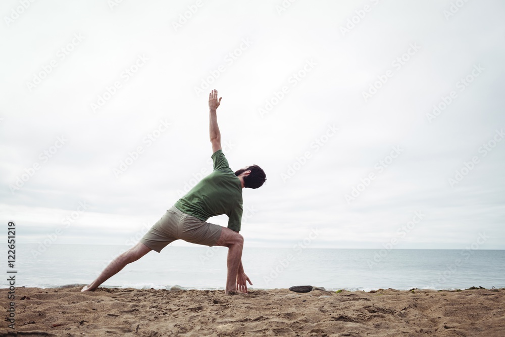 Man performing stretching exercise Man performing stretching exercise