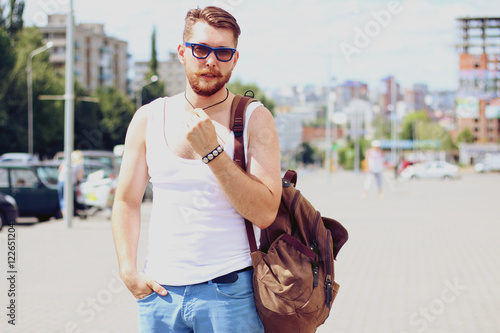 Fashionable caucasian man with beard outdoor in city
